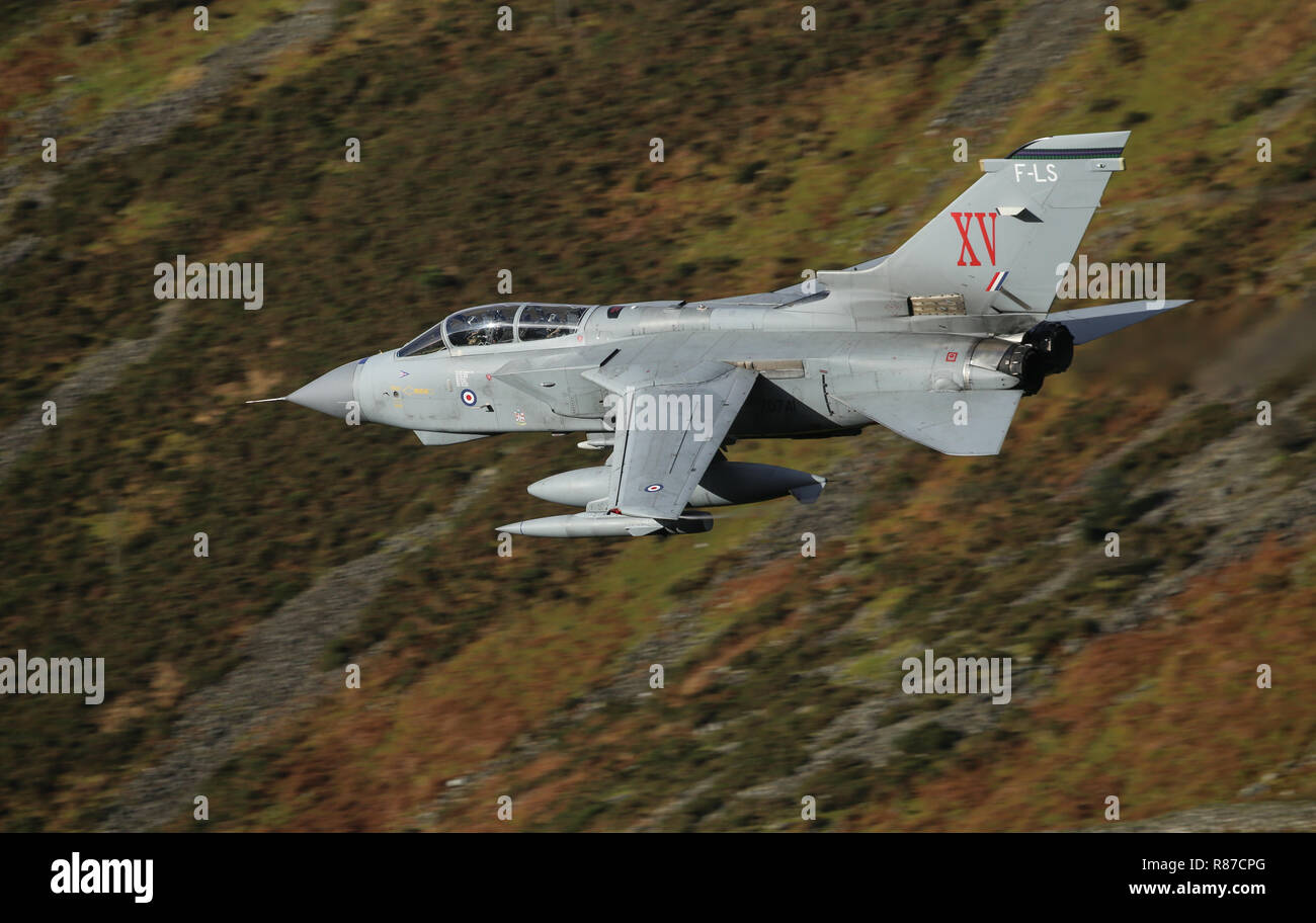 RAF Tornado GR4 on a low level training flight in the mach loop area of Wales, UK. The aircraft has the markings of XV Squadron. Stock Photo