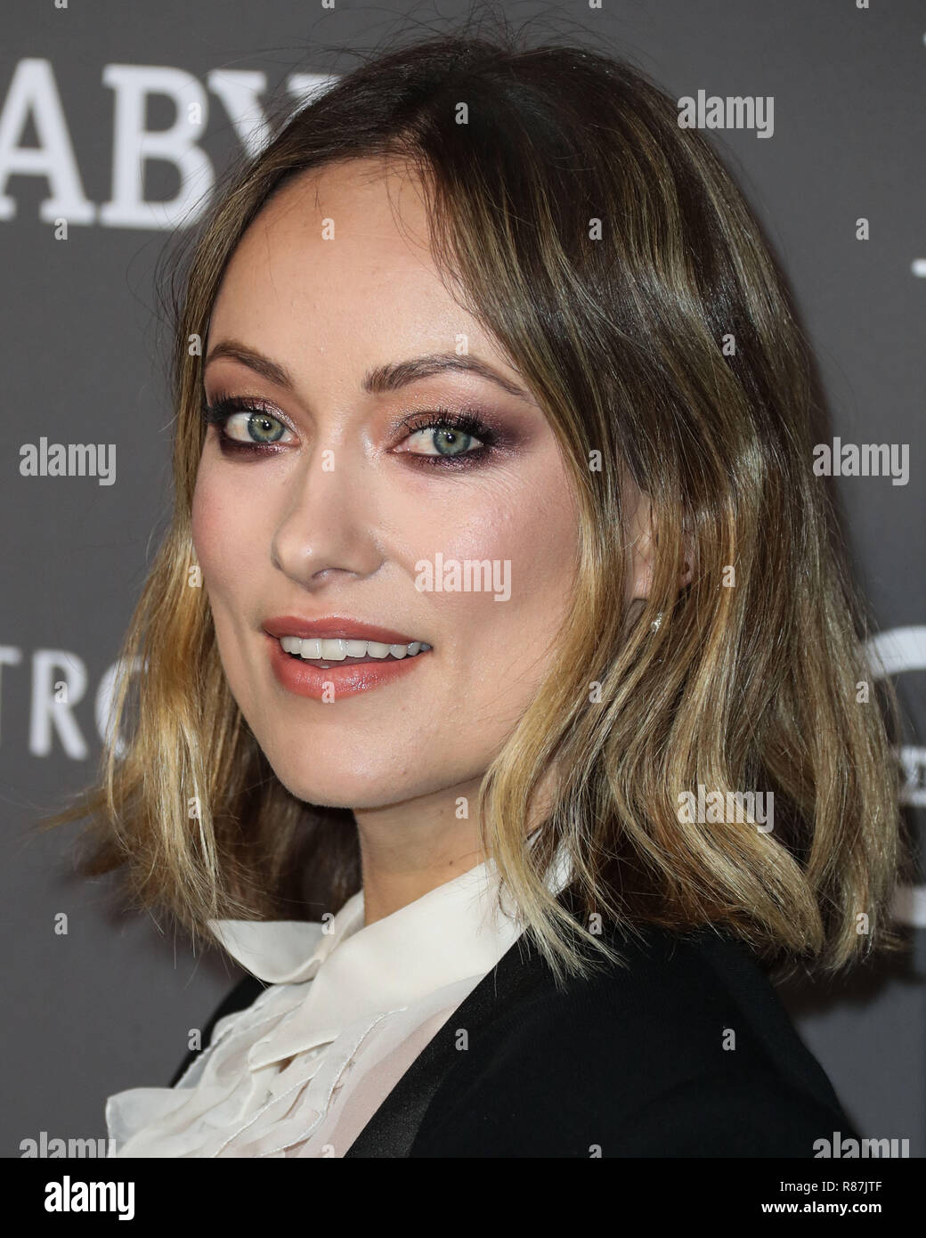 CULVER CITY, LOS ANGELES, CA, USA - NOVEMBER 10: Actress Olivia Wilde  wearing a Givenchy outfit and a Lala Lexa clutch arrives at the 2018  Baby2Baby Gala held at 3Labs on November