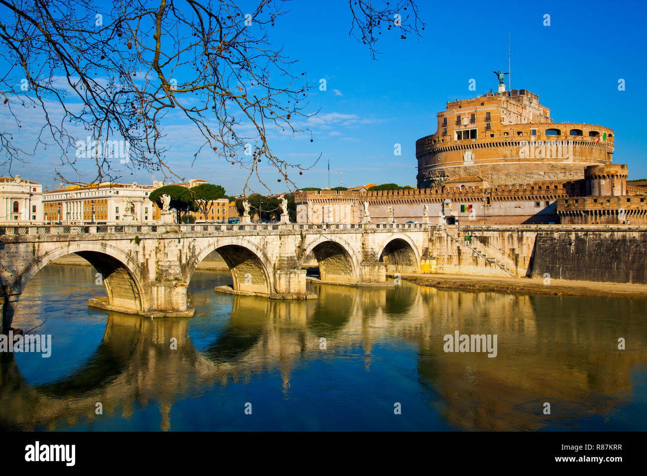 Looking across the Tiber River towards Ponte Sant'Angelo and Castel Sant'Angelo in the Vatican. Stock Photo