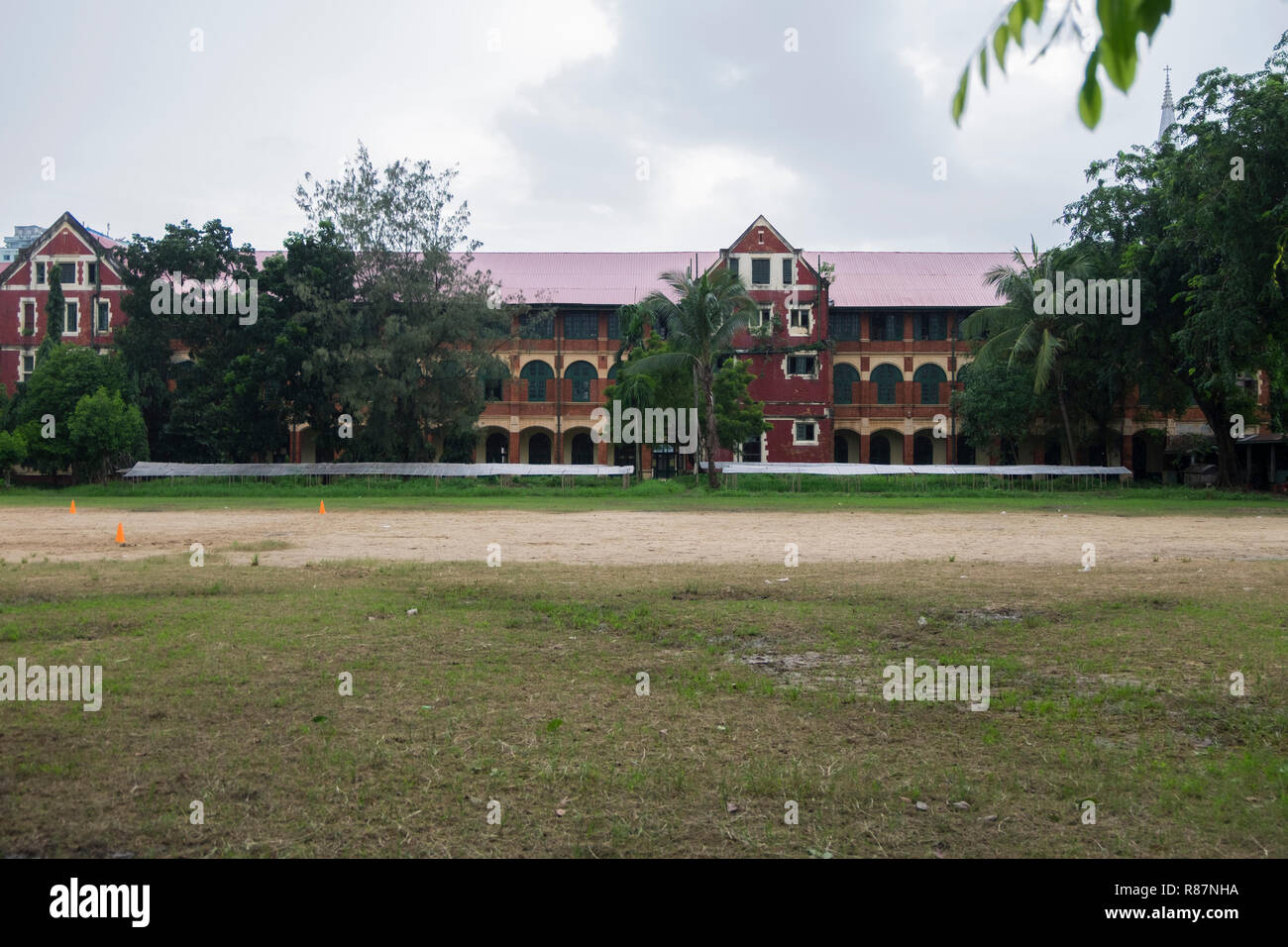 A school, an example of British Colonial Architecture in Yangon, Myanmar. Stock Photo