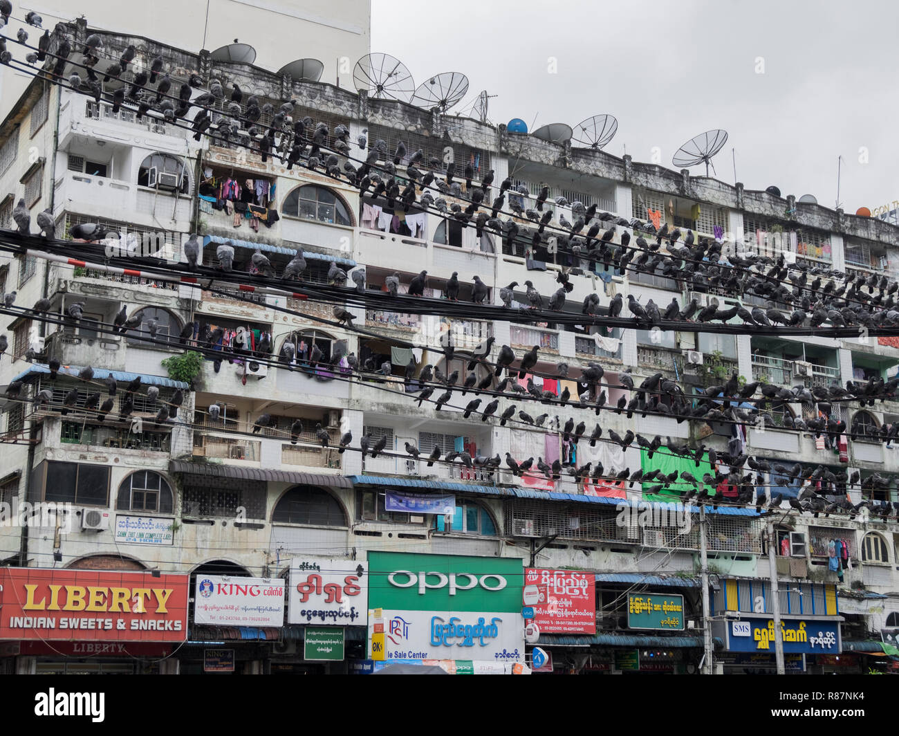 Interesting building facade, showing the gritty urban fabric, in Yangon, Myanmar. Stock Photo