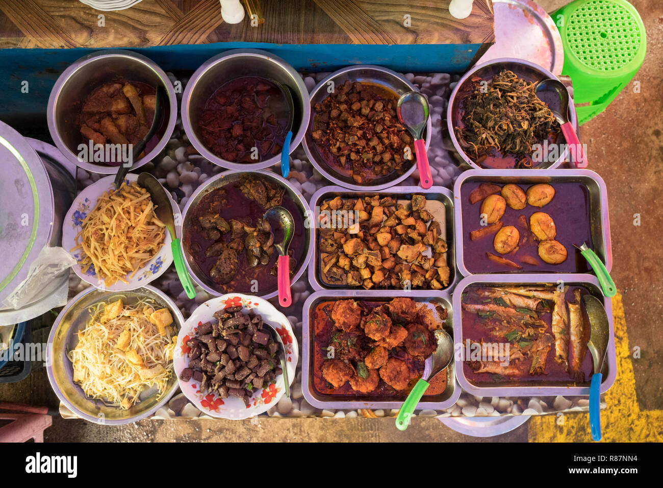 Typical Burmese food at a lunch stall in Yangon, Myanmar. Stock Photo