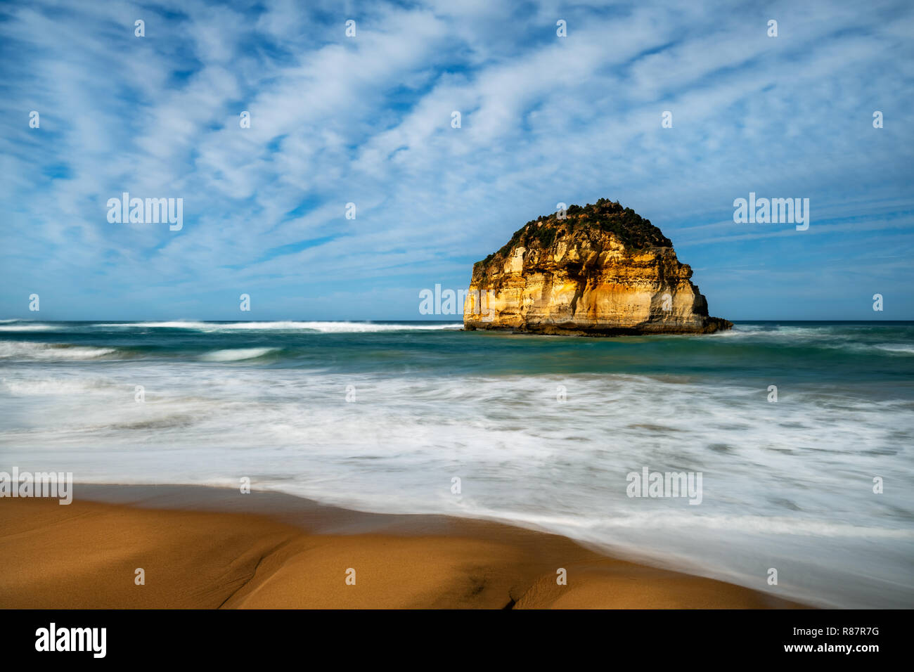 Well hidden sea stack in Sandy Cove at the Great Ocean Road. Stock Photo