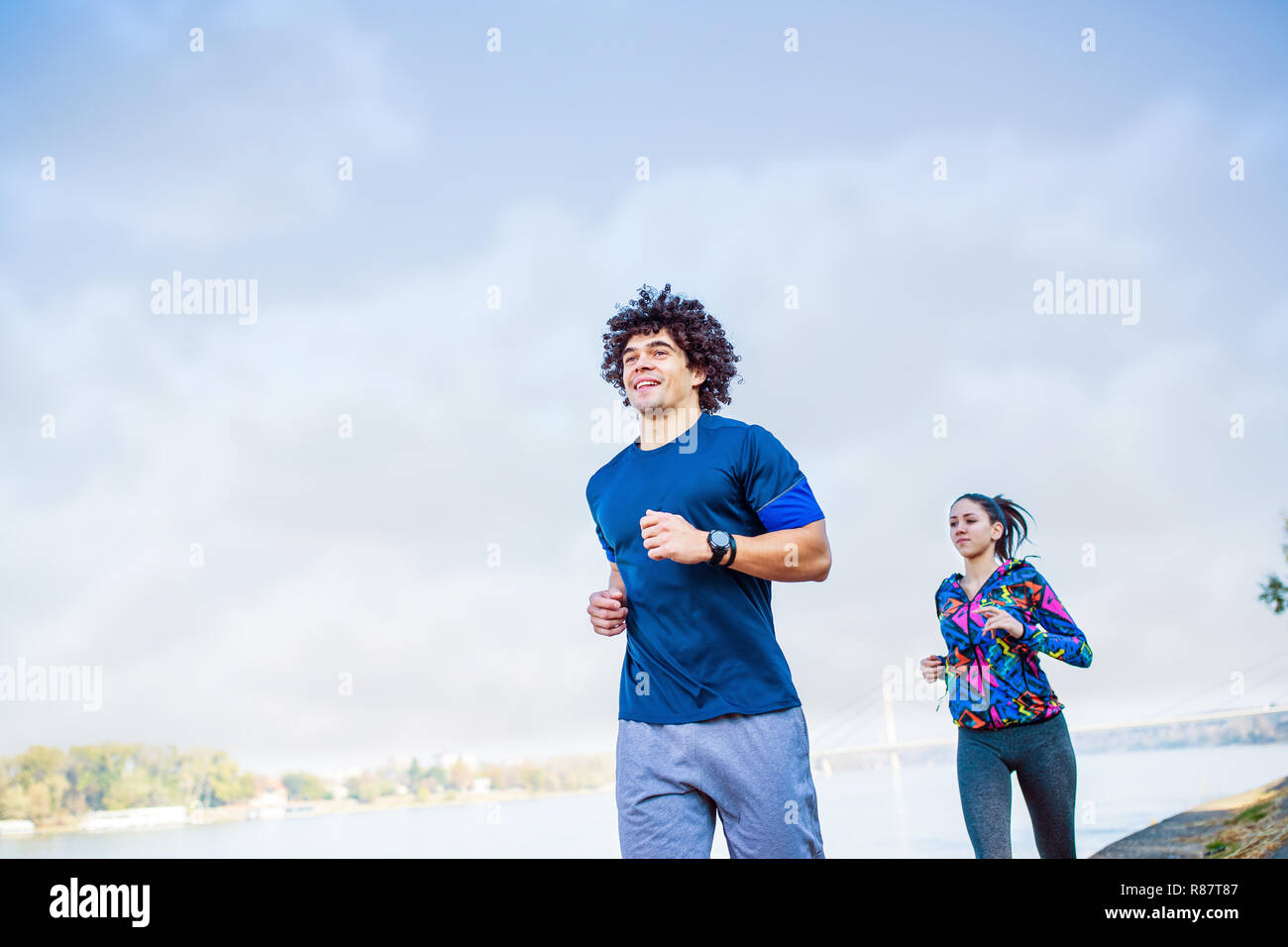 Couple jogging and running outdoors healthy lifestyle Stock Photo - Alamy