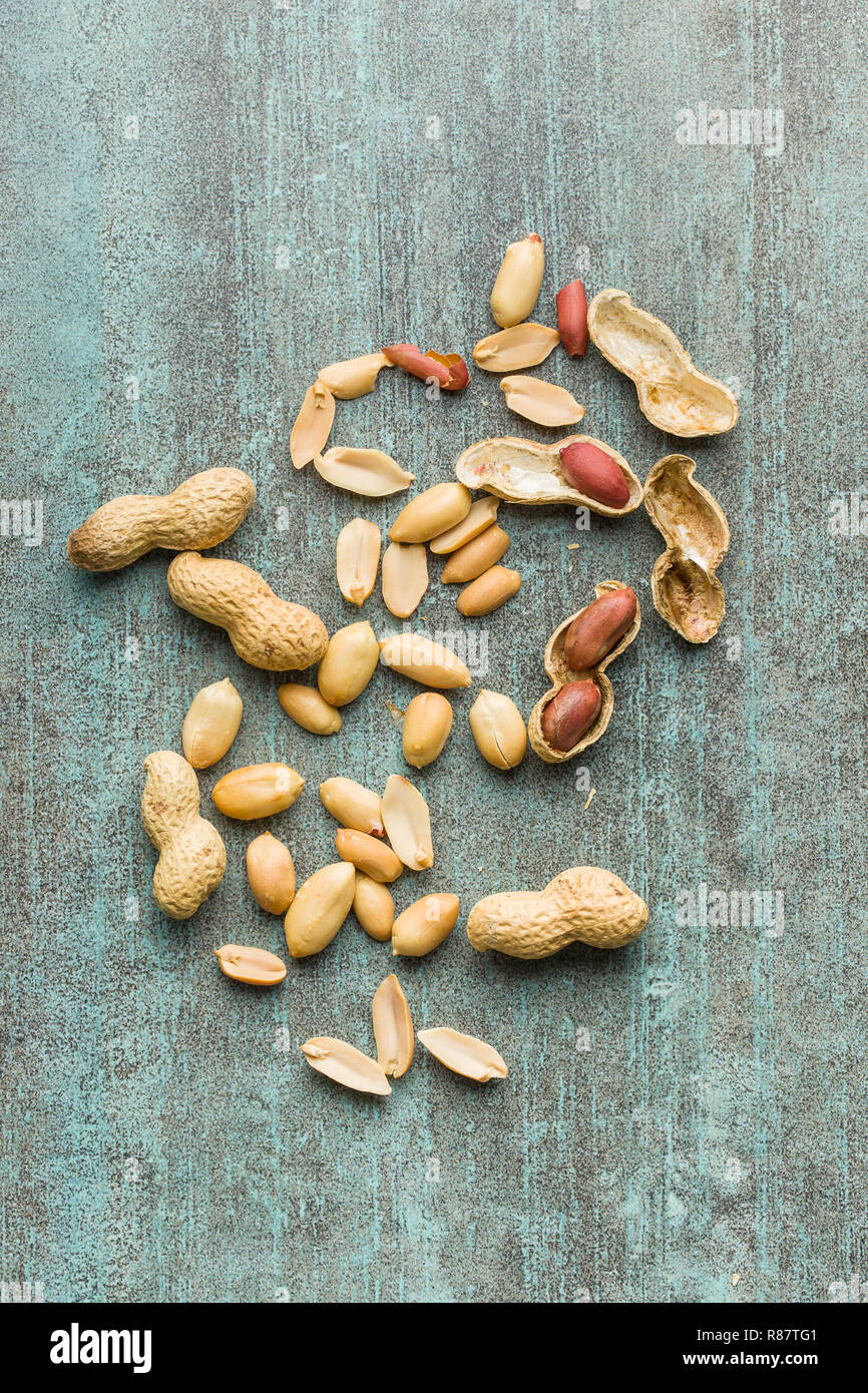 The dried peanuts. Groundnuts on old table. Top view. Stock Photo