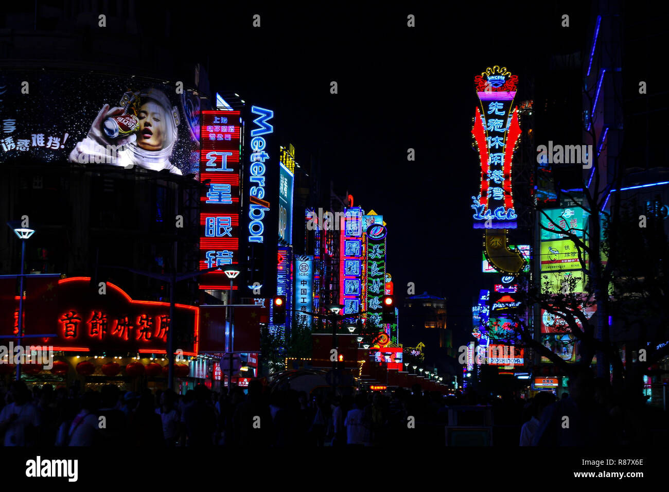 City street illuminated by neon lights and signs in all colors. Shanghai,  China Stock Photo - Alamy