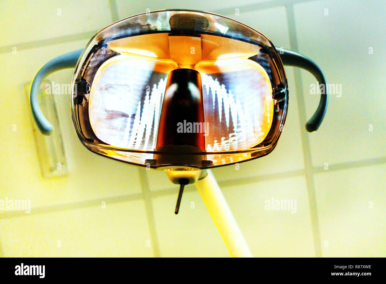 Bright Dentist examination light as seen by a patient sitting in the Dentist Surgery Chair at local Dentist Surgery in South Yorkshire, England Stock Photo