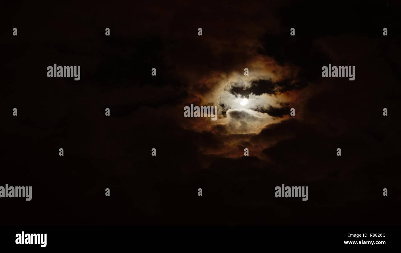 Moon and night sky with clouds Stock Photo - Alamy