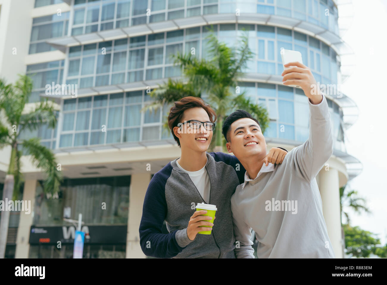 Two happy young handsome men hi-res stock photography and images - Alamy
