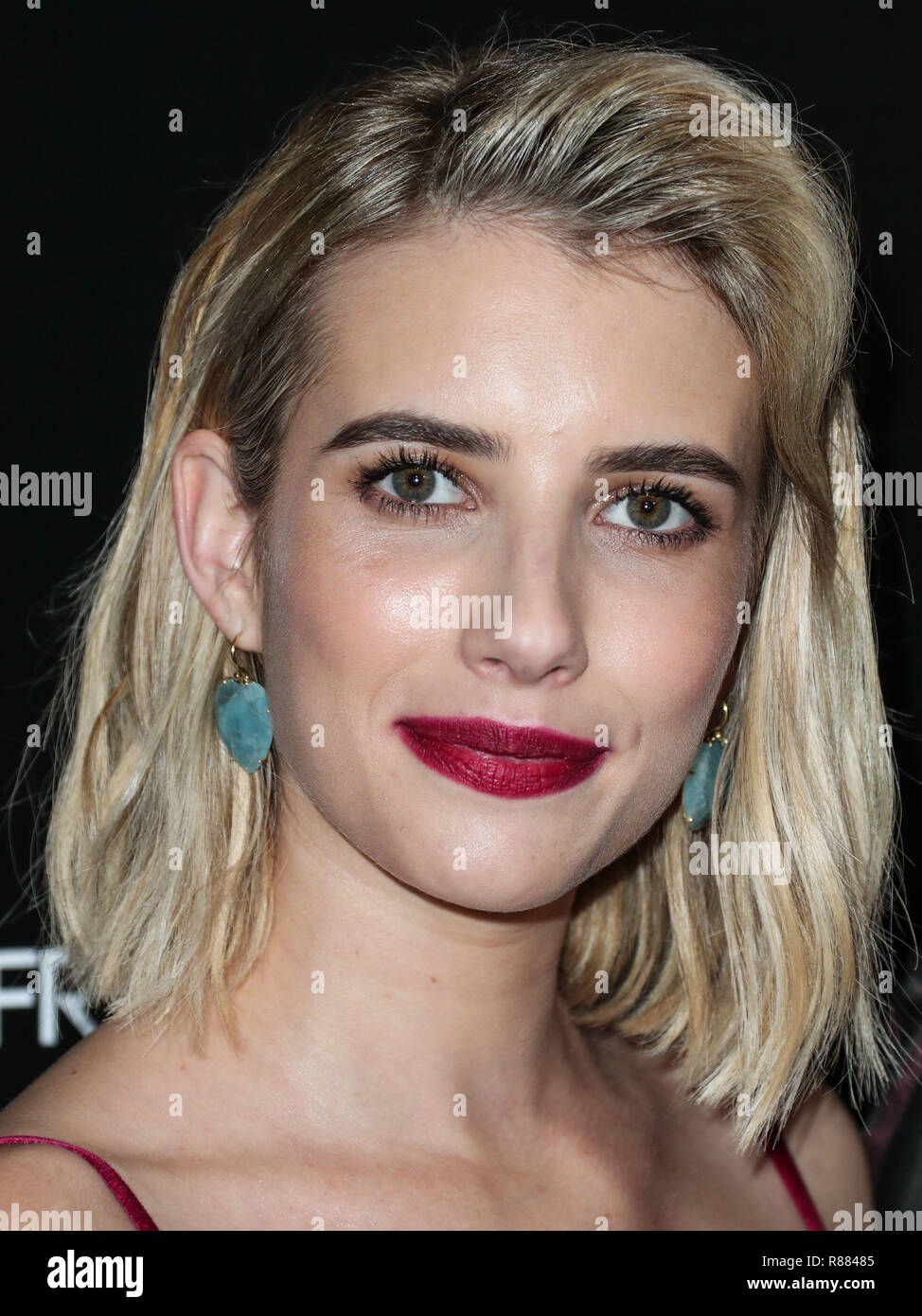 WEST HOLLYWOOD, LOS ANGELES, CA, USA - 30: Actress Emma Roberts wearing Markarian dress, Christian Louboutin heels, and Irene Neuwirth jewelry arrives at the Los Angeles Premiere Of Entertainment's '