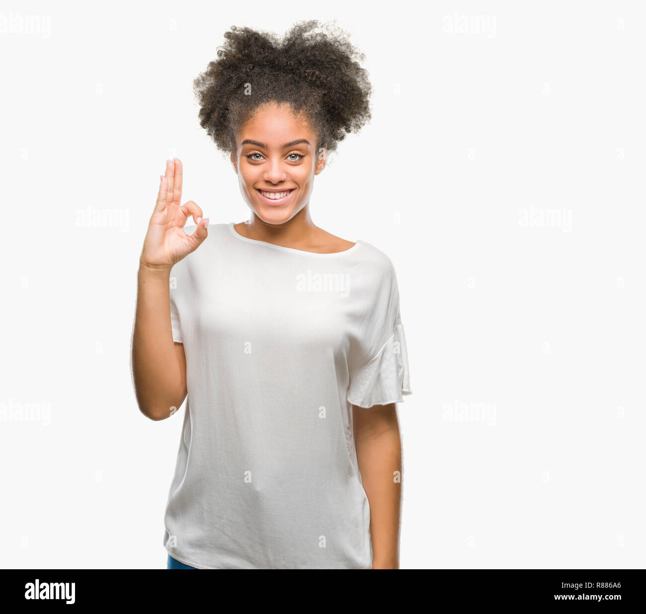 Young afro american woman over isolated background smiling positive ...