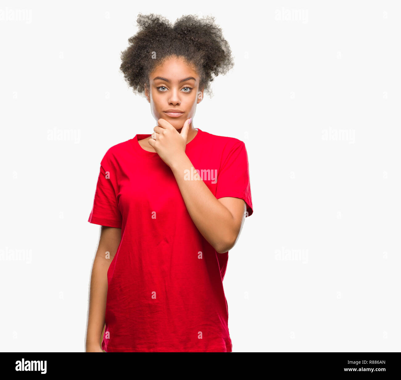 Young afro american woman over isolated background looking confident at ...