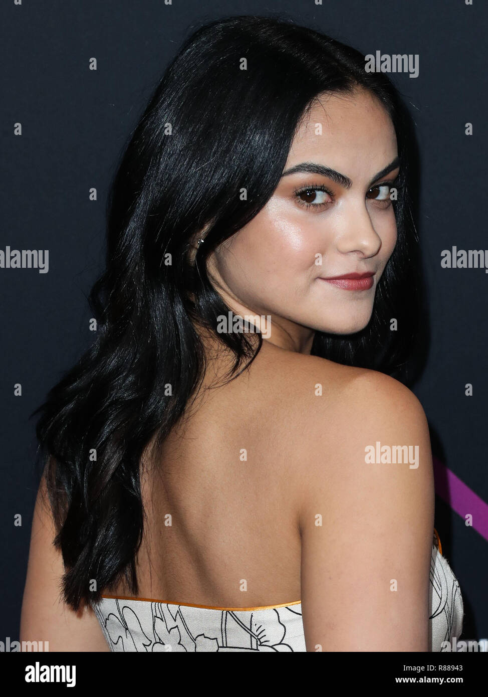 SANTA MONICA, LOS ANGELES, CA, USA - NOVEMBER 11: Actress Camila Mendes  wearing an Etro dress, Tory Burch shoes, and Clean Origin jewelry (styled  by Jason Bolden) arrives at the People's Choice