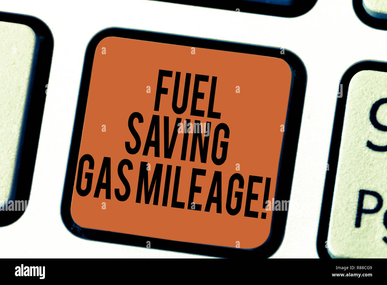 Handwriting text writing Fuel Saving Gas Mileage. Concept meaning Expending less money in vehicle expenses gas savings Keyboard key Intention to creat Stock Photo