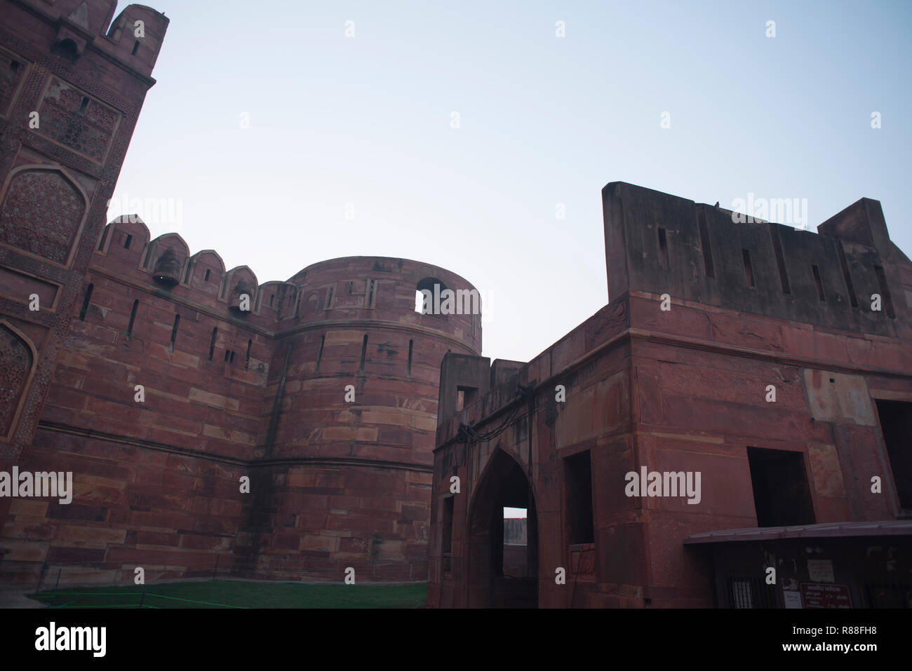 Splendor of mughal architecture of Agra Fort also called as the red fort with high thick strong walls made of red stones with arcs doors and windows Stock Photo