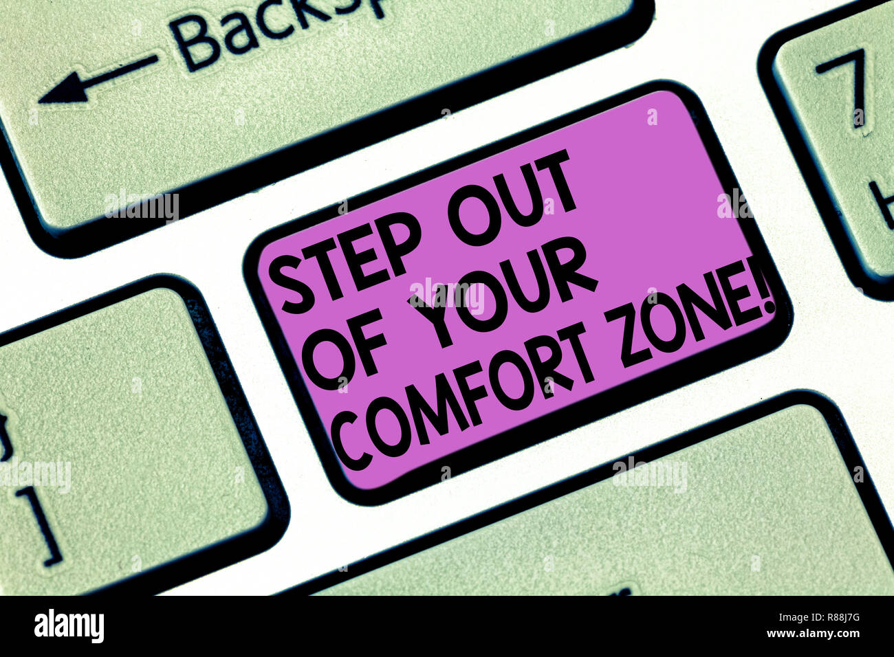 Conceptual hand writing showing Step Out Of Your Comfort Zone. Business photo showcasing Do different things leave the routine Keyboard key Intention Stock Photo