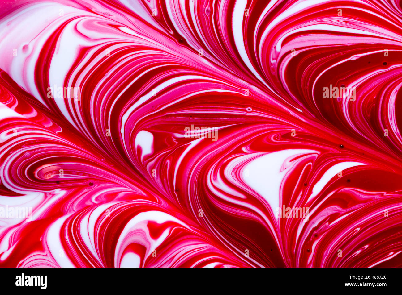 Colourful abstract background of red, white and pink swirl ...