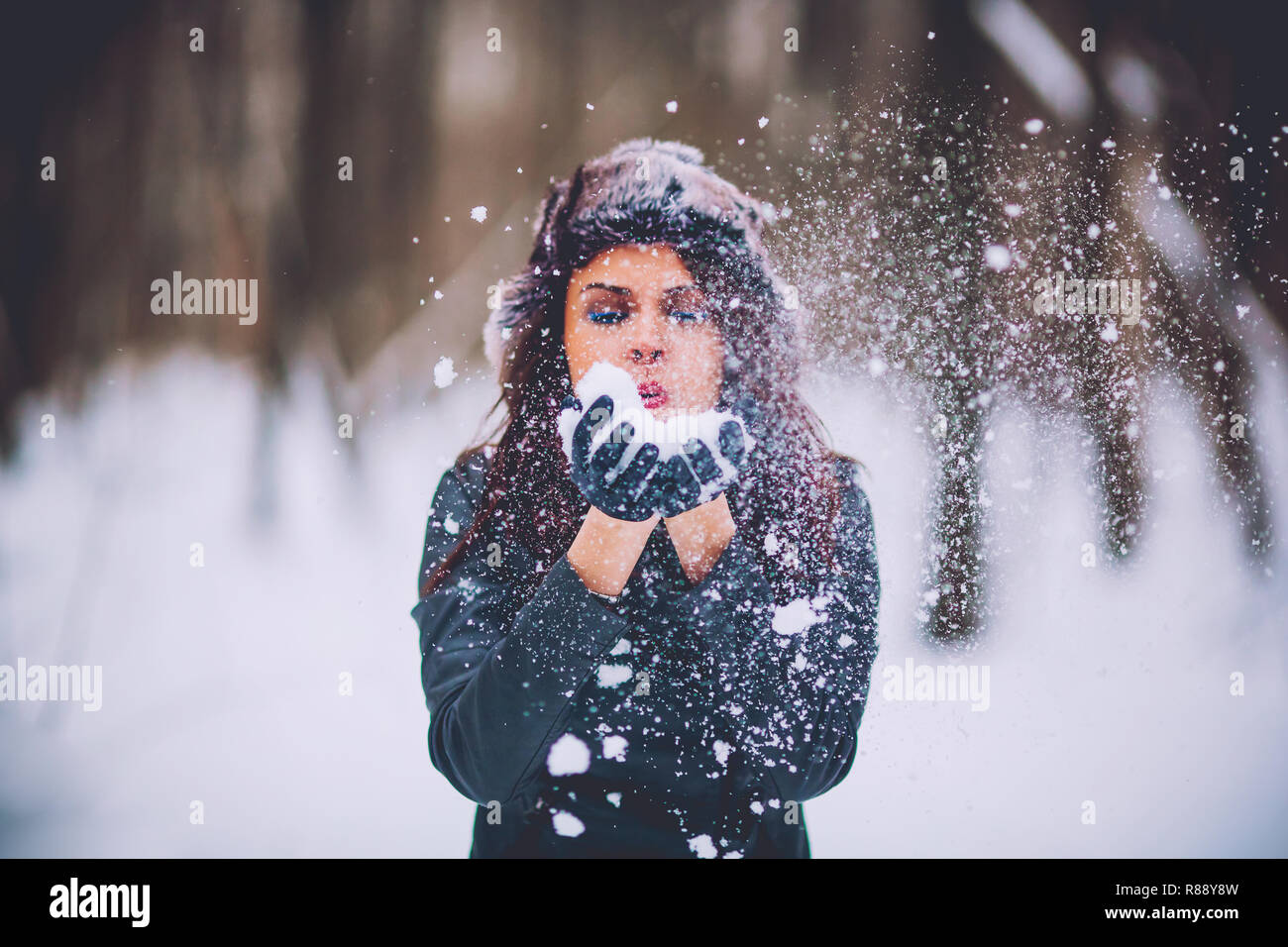 girl against the background of the winter forest Stock Photo