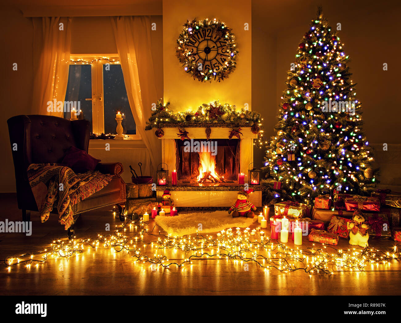 Beautiful decorated living room with a christmas tree and a fire place ...
