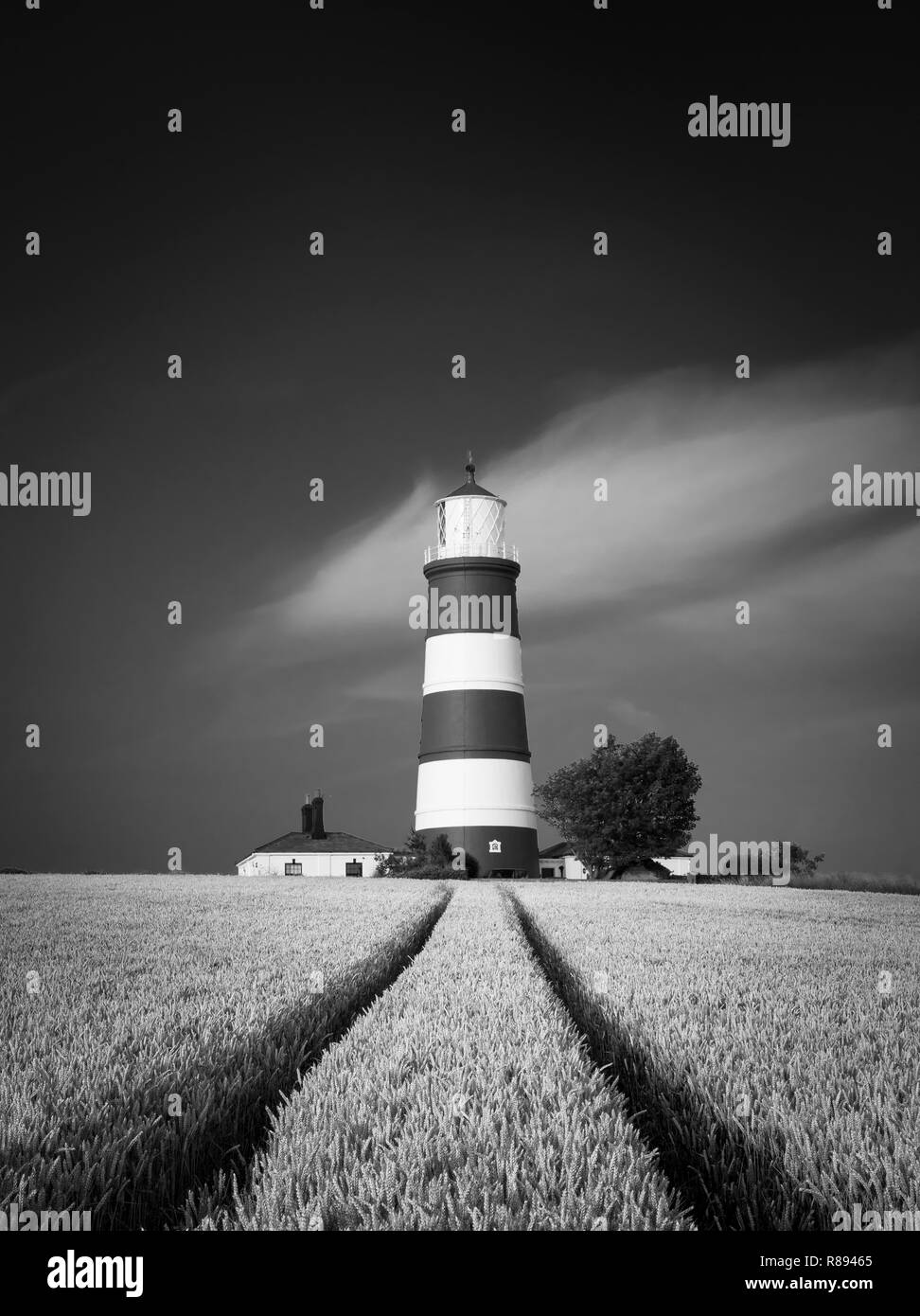 Stright lines lead towards a striped lighthouse Stock Photo Alamy
