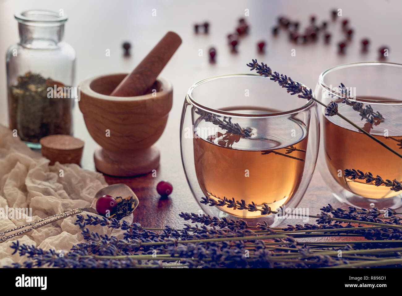 Herbal tea in a glass cups with lavender and some dry berries Stock Photo