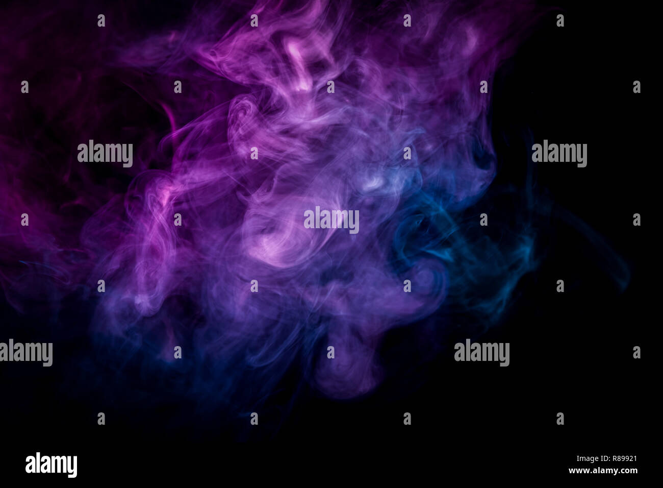 Cloud of pink and blue smoke on a black isolated background. Background ...