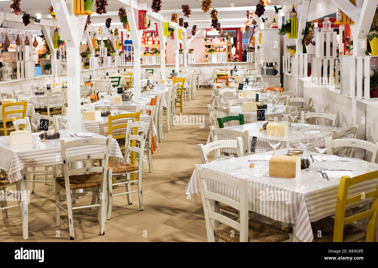 Empty Restaurant In The Market With White Square Tables