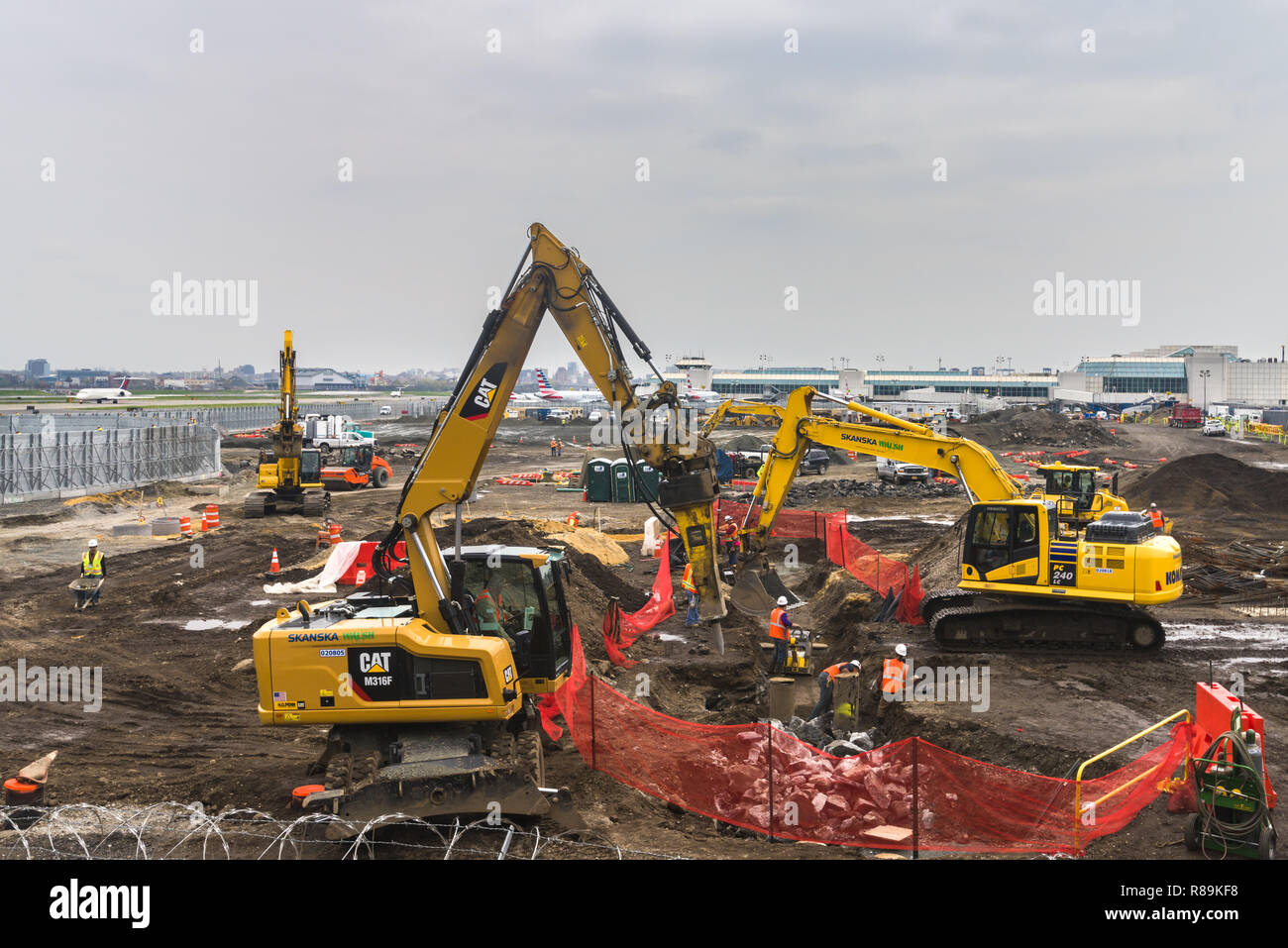 Construction equipment and workers building the new terminal at La Guardia airport in Queens, New York, USA Stock Photo