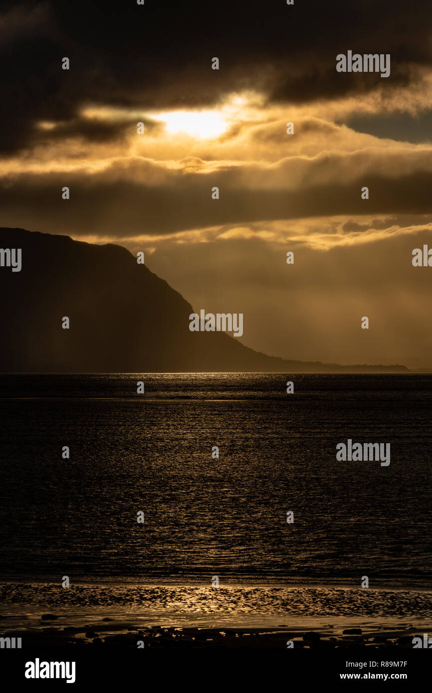 Sunset with clouds over the Irish Sea at Llandudno West Shore, North Wales Stock Photo