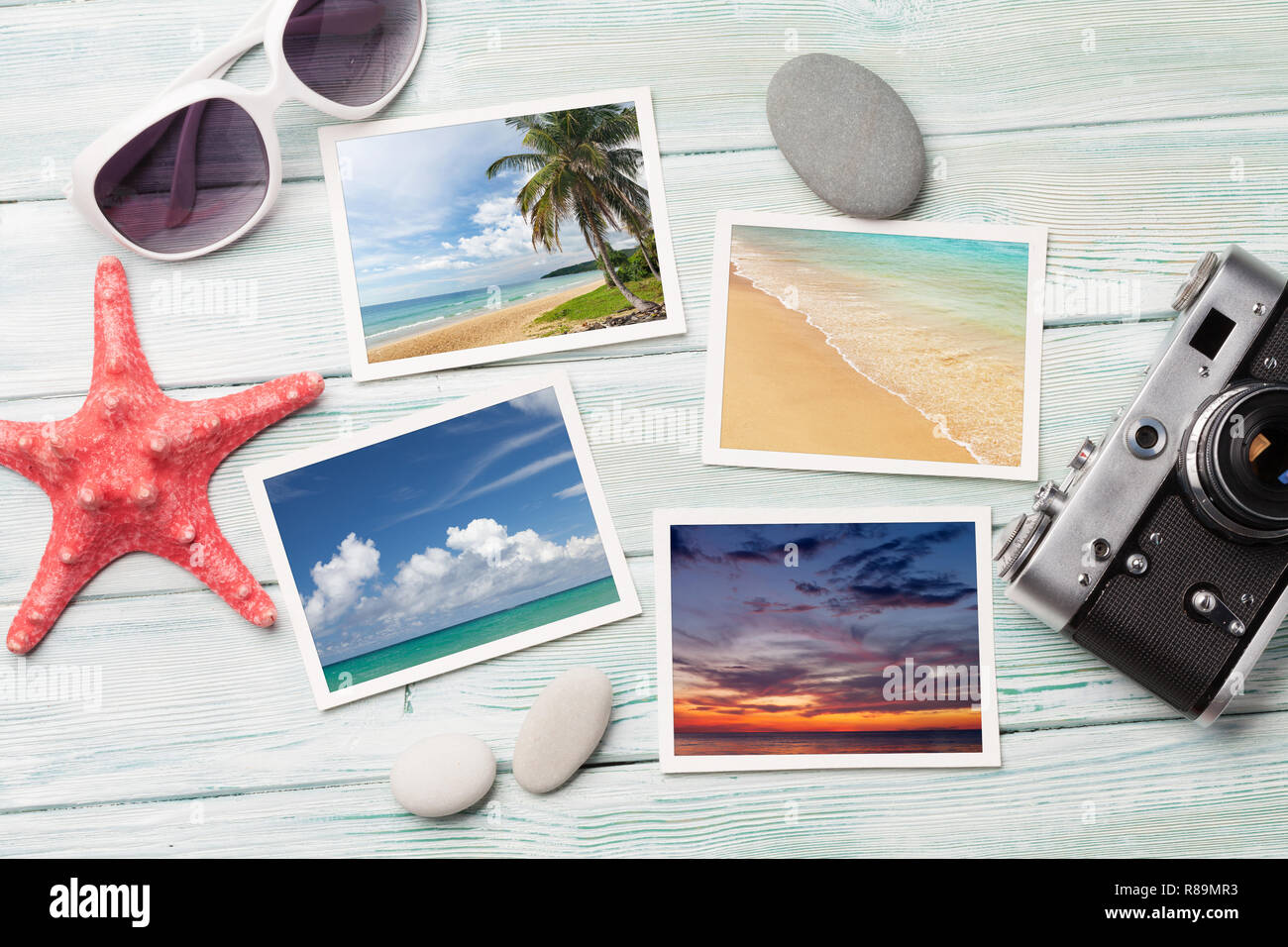 Travel vacation concept with sunglasses, camera and weekend photos on wooden backdrop. Top view. Flat lay. All photos taken by me Stock Photo