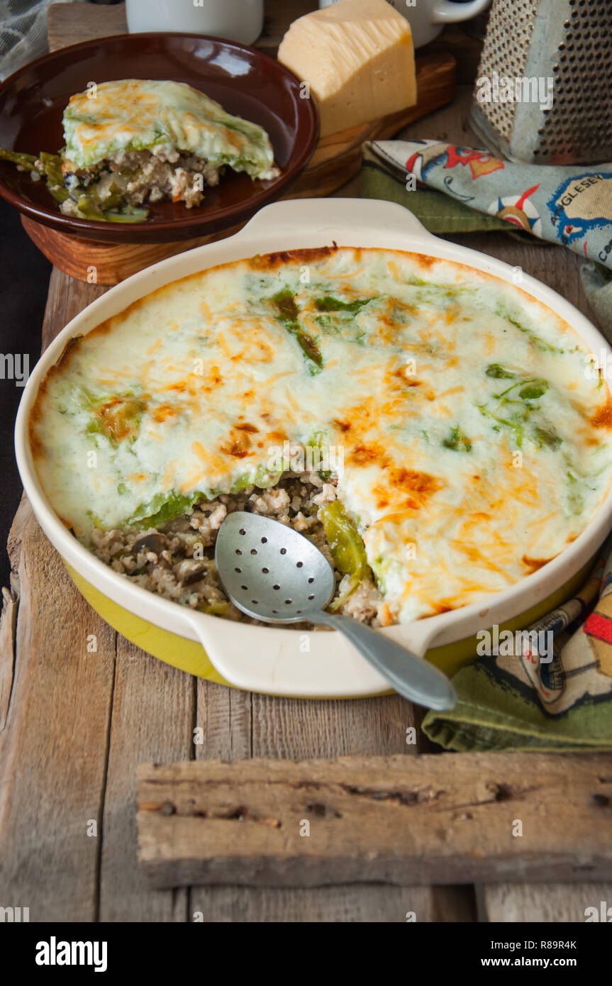 Young cabbage lasagna stuffed with vegetables and rice with bechamel