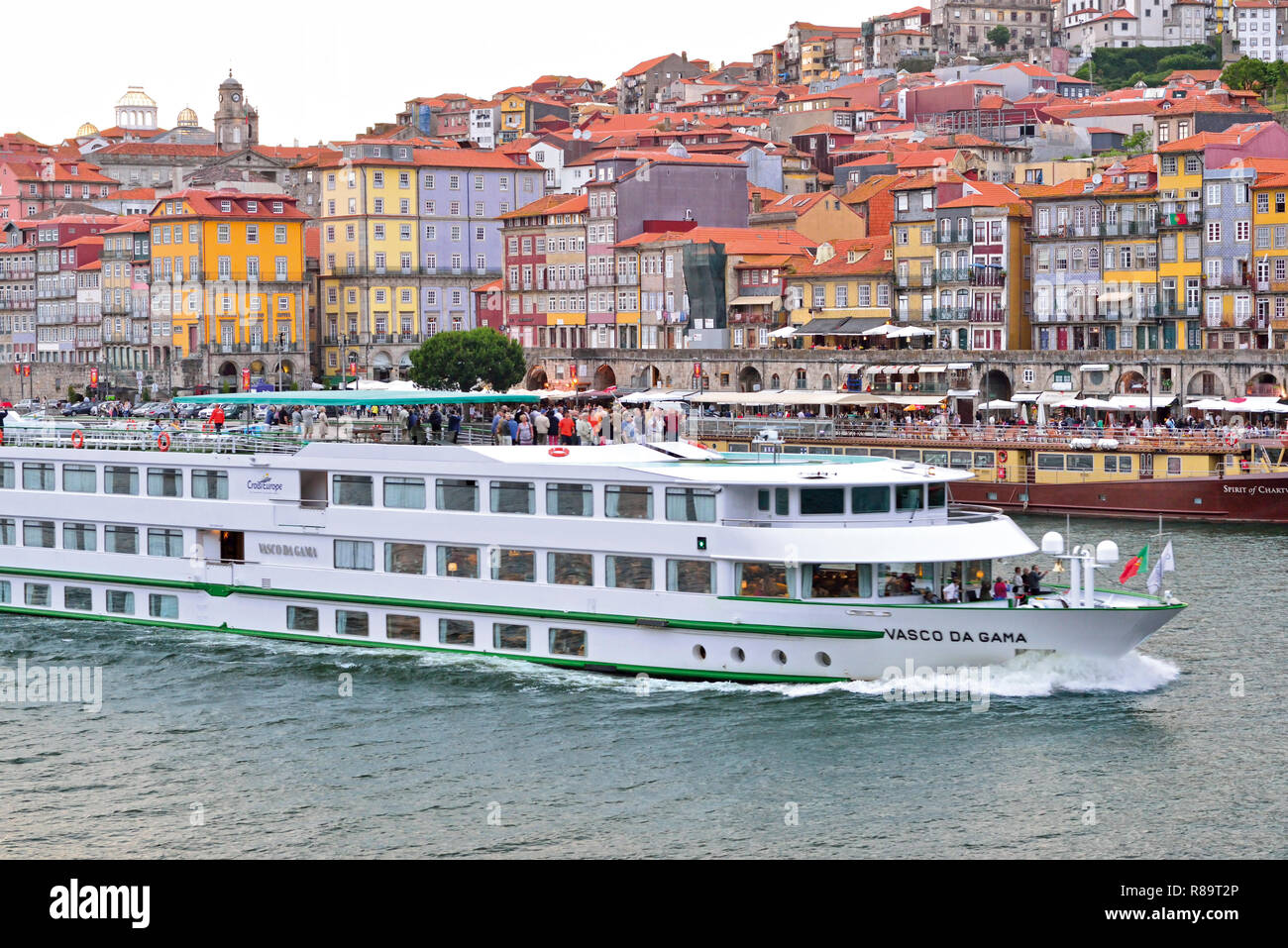 Passenger river cruise ship MS Vasco da Gama parting from Porto heading east to the Upper Douro region Stock Photo