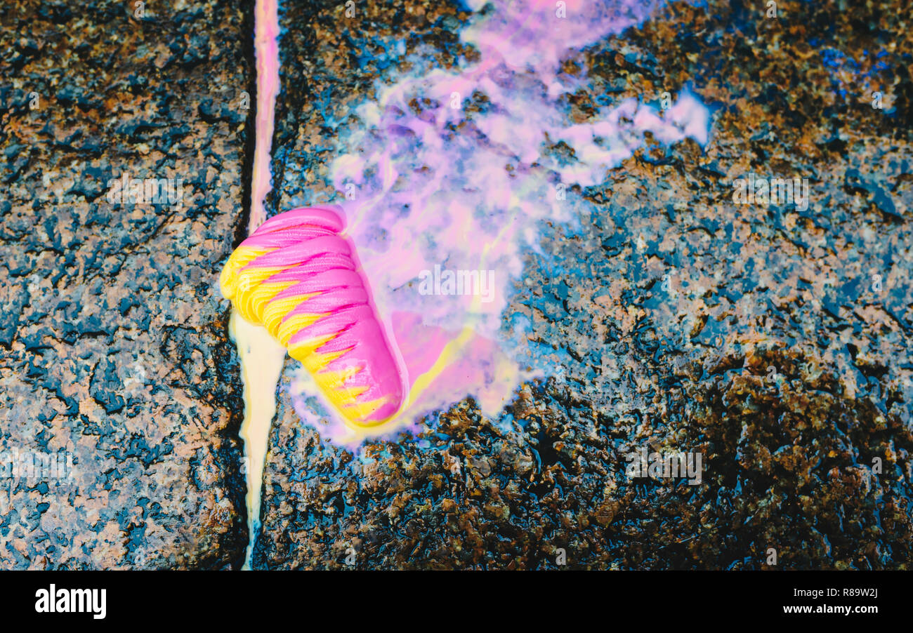 Icecream on the ground - colorful icecream dropped on the stone floor and melt on ground - copy space for text, dirty concept,  lost concept Stock Photo