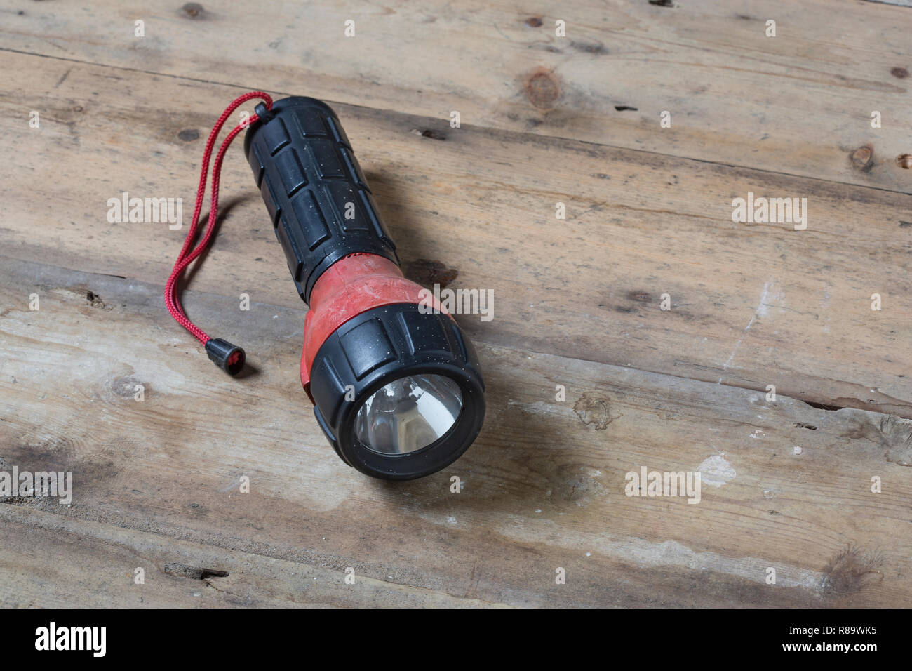An old red and black rubber torch Stock Photo