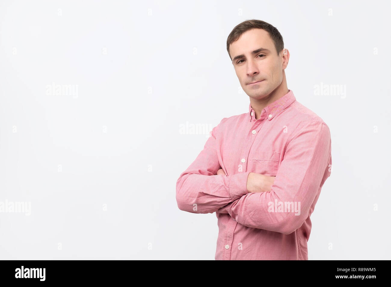 Confident man in pink shirt hi-res stock photography and images - Alamy