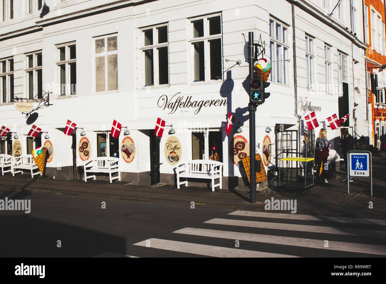 Restaurant selling waffles lined with Danish flags, Nyhavn, Copenhagen, Denmark, Scandinavia Stock Photo