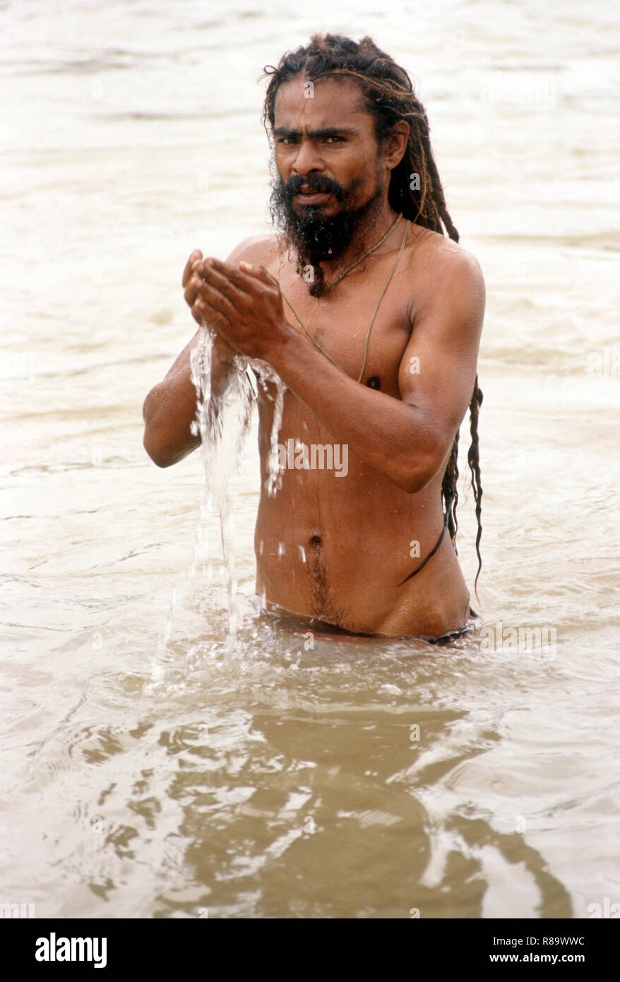 holy man (sadhu) bathing in ramkund, nashik, kumbhmela 8/9/91, maharashtra, india Stock Photo