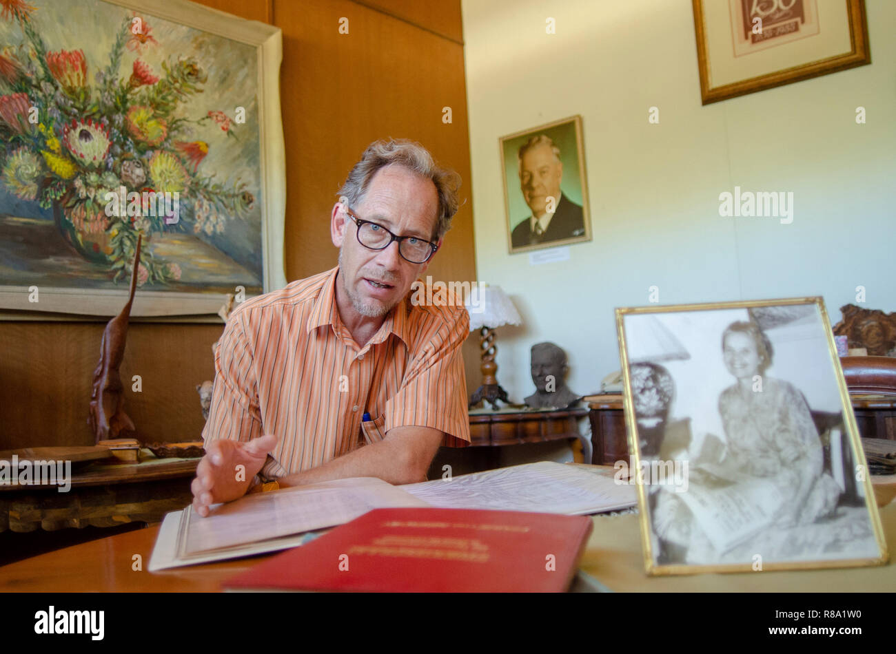 Carel Boshoff (junior) the grandson of H.F. Verwoerd, the mastermind of Apartheid, is looking at a photo album of a 1995 visit from South African President Nelson Mandela, in Orania, the Northern Cape, Friday, December 12, 2013. Photo: Eva-Lotta Jansson Stock Photo