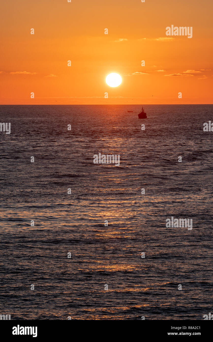 Sun Setting over the North Atlantic Ocean, Larache, Morocco Stock Photo