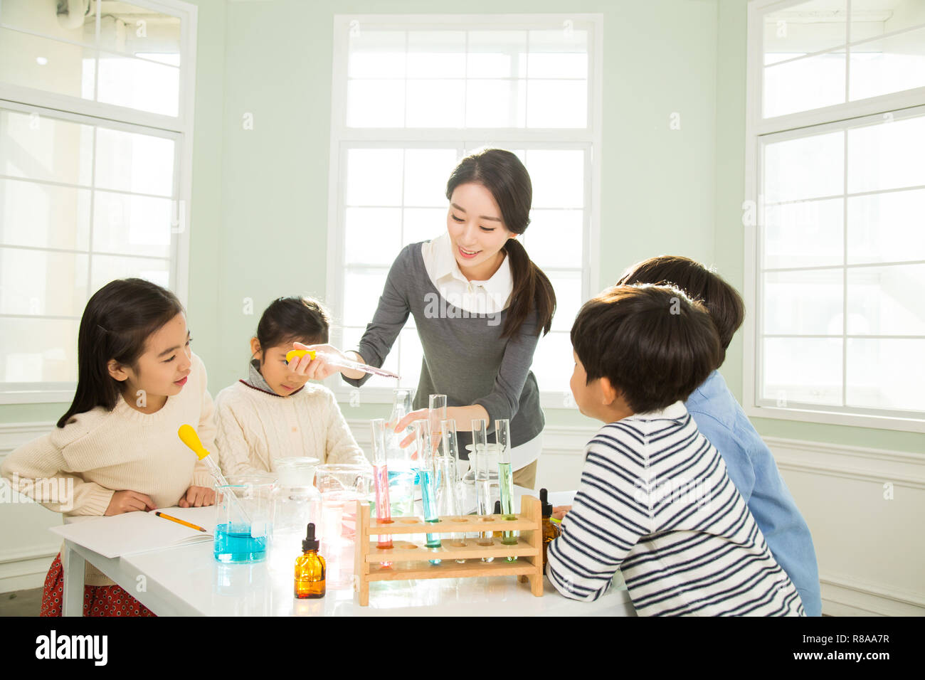 Young Students In Science Class With A Female Teacher Stock Photo - Alamy