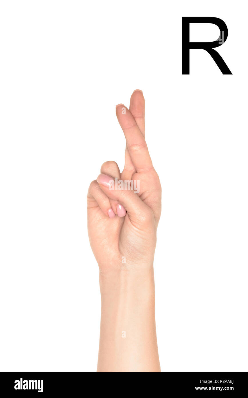 partial view of woman showing latin letter - R, deaf and dumb language ...