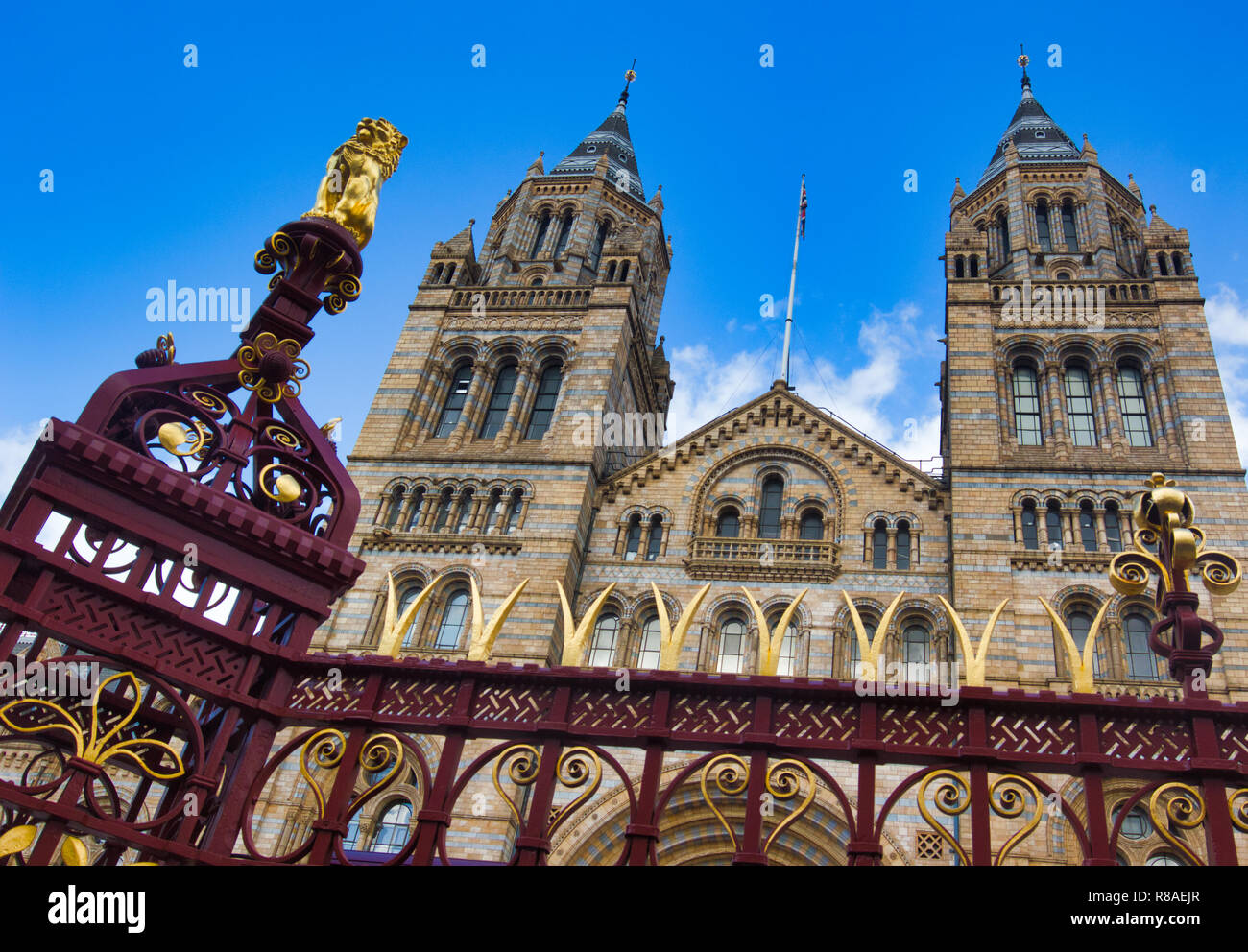 Decorative ornate railings and the exterior of the Victorian era Natural History Museum, South Kensington, London, England Stock Photo