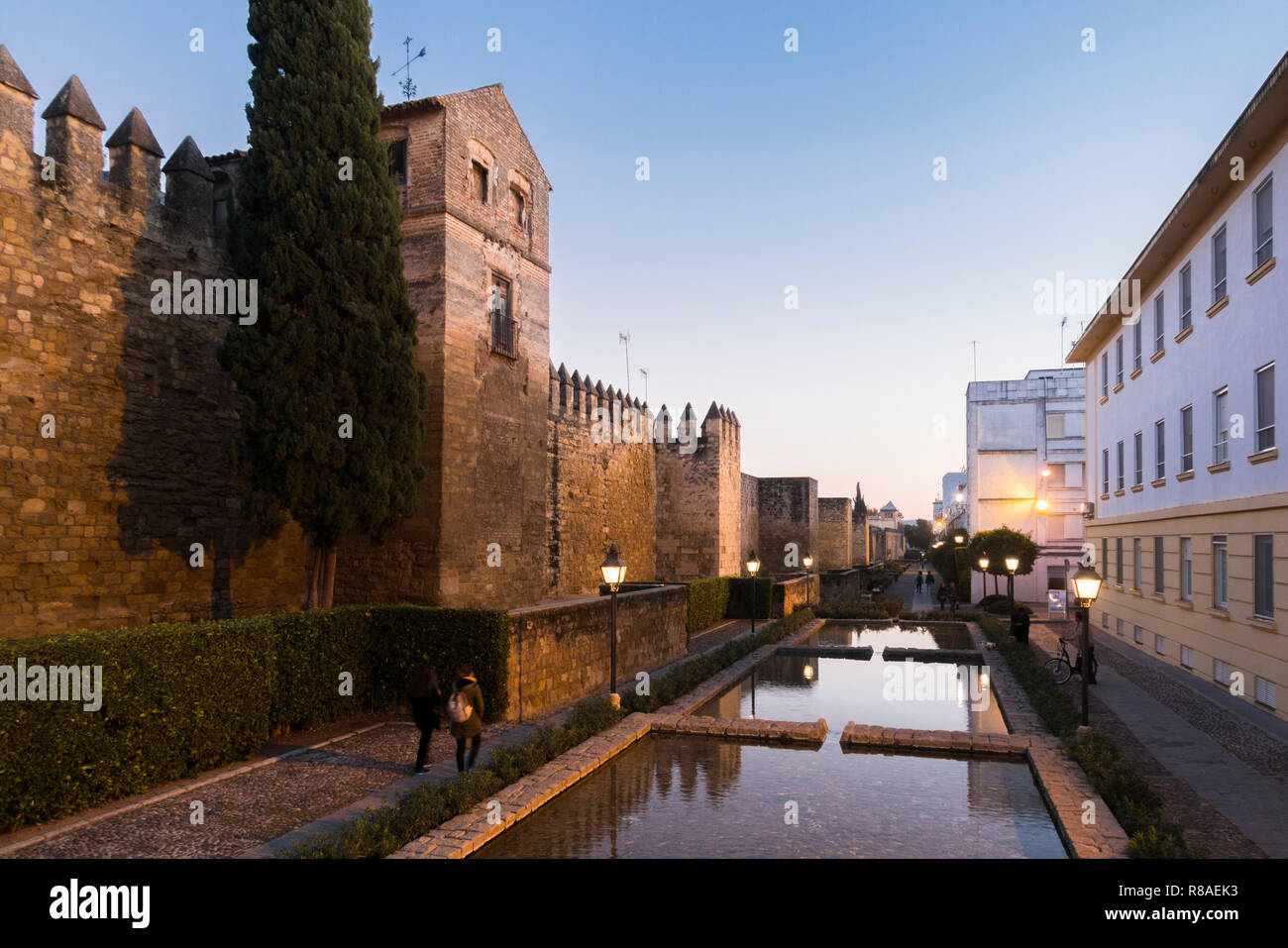 Cordoba, ancient medieval city walls running along the calle Cairuán with water channels at sunset, Cordoba, Andalusia, Spain. Stock Photo