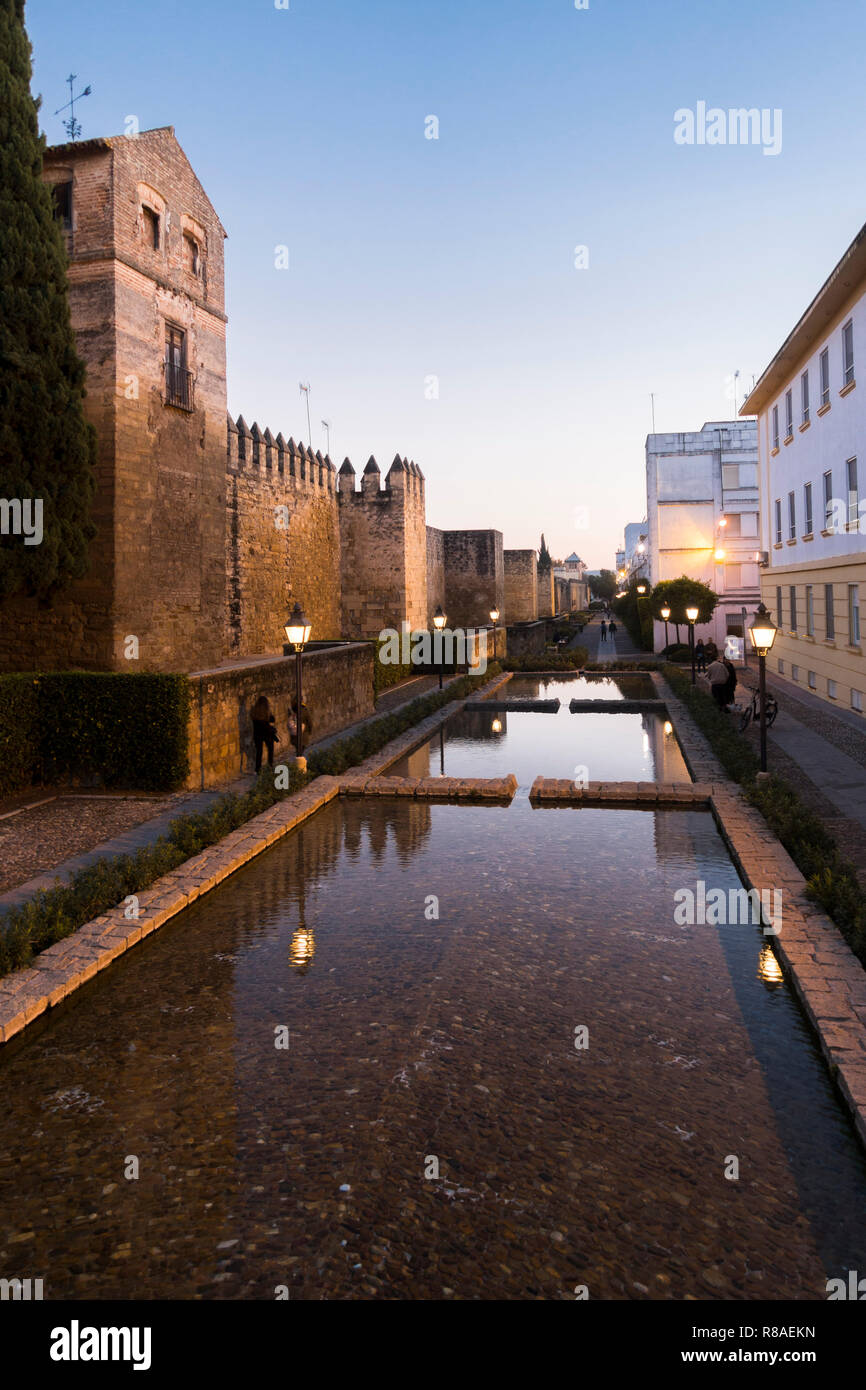 Cordoba, ancient medieval city walls running along the calle Cairuán with water channels at sunset, Cordoba, Andalusia, Spain. Stock Photo