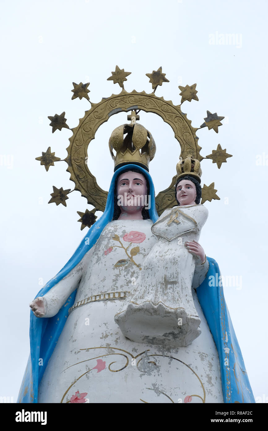 Statue of the virin MNary decorating the roof of the Catholic Roman Our Lady of Atocha Church in the city of Alicia in Isabela province in the Philippines Stock Photo