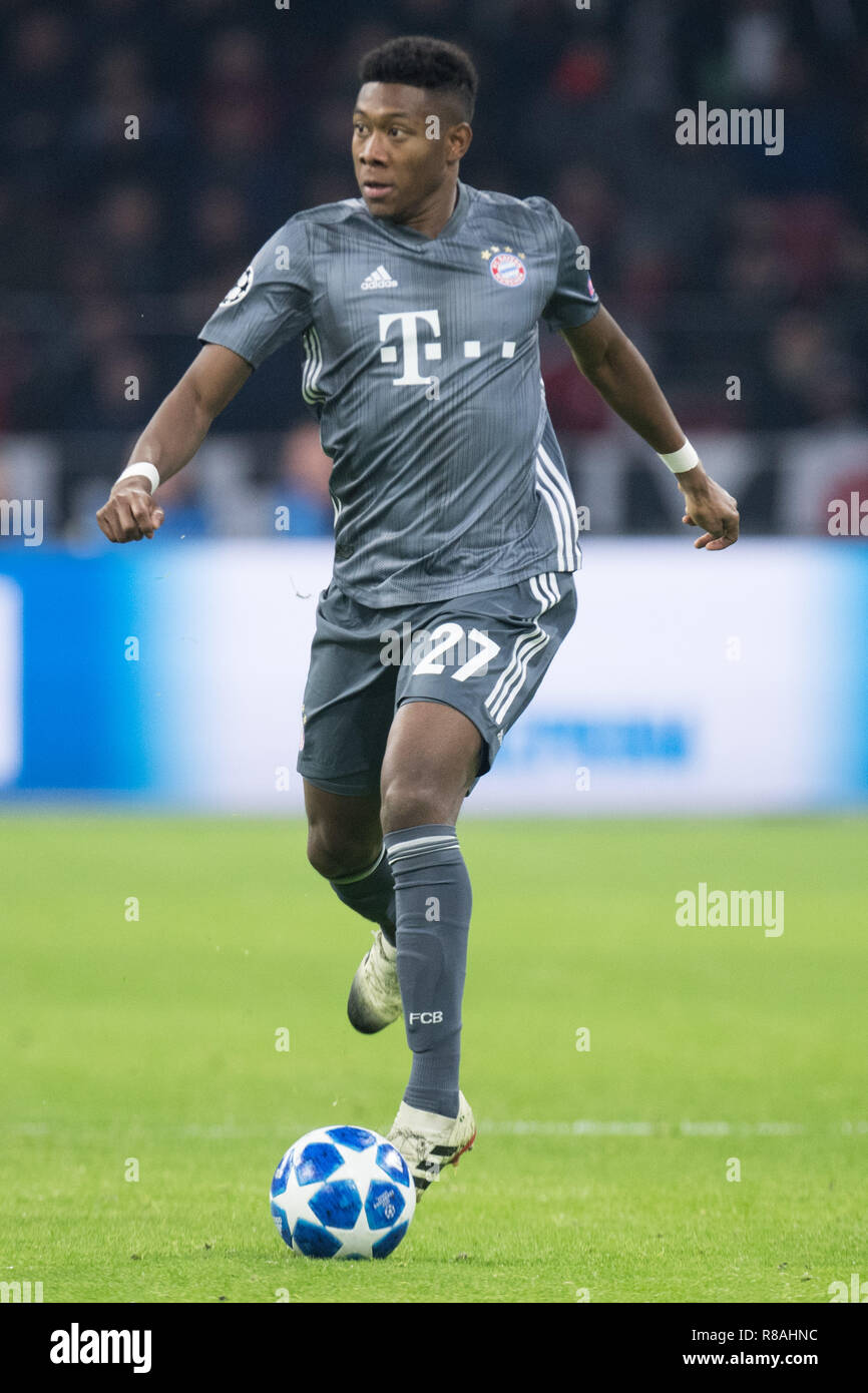 Amsterdam, Niederlande. 13th Dec, 2018. David ALABA (M) with Ball, Individual with ball, Action, Full figure, Portrait, Soccer Champions League, Group stage, Group E, matchday 6, Ajax (Ajax) - Bayern Munich (M) 3: 3, 12.12. 2018 in Amsterdam/Netherlands. | Usage worldwide Credit: dpa/Alamy Live News Stock Photo