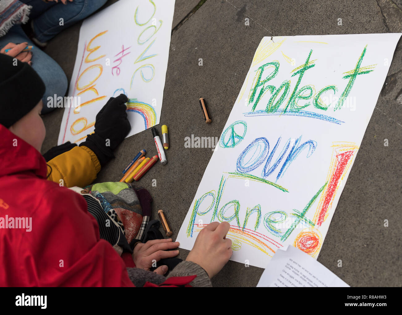 Berlin, Germany. 14th Dec, 2018. Students demonstrate in the city centre under the motto 'Future without climate chaos' and paint posters with the inscription 'Protect our planet! Credit: Peter Kneffel/dpa/Alamy Live News Stock Photo