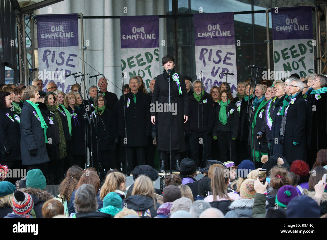 Manchester, UK. 14th Dec 2018. A choir performs at  the unveiling of a statue of Suffragette Emmeline Pankhurst by sculpture designer Hazel Reeves. The day marks 100 years since Women won the vote.Manchester, UK, 14th December 2018 Credit: Barbara Cook/Alamy Live News Stock Photo