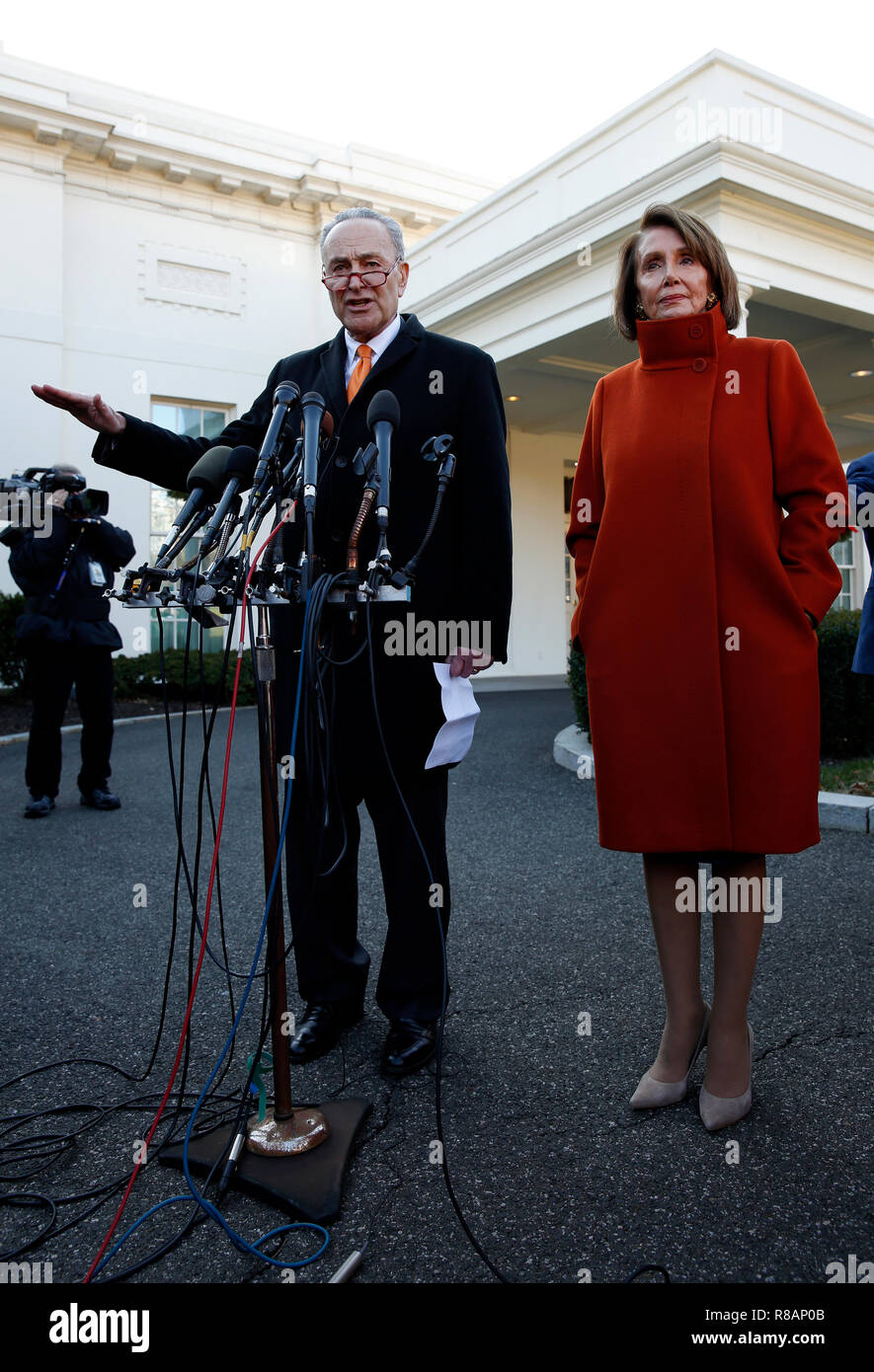 Washington, United States Of America. 11th Dec, 2018. United States Senate Minority Leader Chuck Schumer (Democrat of New York) and US House Speaker-designate Nancy Pelosi (Democrat of California) talk to reporters outside the West Wing of the White House following a contentious meeting with President Donald Trump on shutting down the government over border security differences, in Washington, DC, December 11, 2018. Credit: Martin H. Simon/CNP/AdMedia/Newscom/Alamy Live News Stock Photo