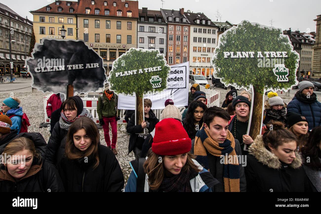 Munich, Bavaria, Germany. 14th Dec, 2018. As part of a worldwide action, 100 students and concerned citizens participated in a climate strike at Munich's Max Joseph Platz. The protestors are calling on world governments to take decisive action against climate change.The Friday strikes were started by 15 year old Swedish student Greta Thunberg who strikes in front of the Parliament in Stockholm on Fridays instead of attending classes. Thunberg is currently in Katowice, Poland, where she's attending the COP24 climate talks. Credit: Sachelle Babbar/ZUMA Wire/Alamy Live News Stock Photo